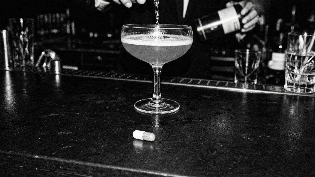 NAC and alcohol liver support - supplement capsule next to cocktail