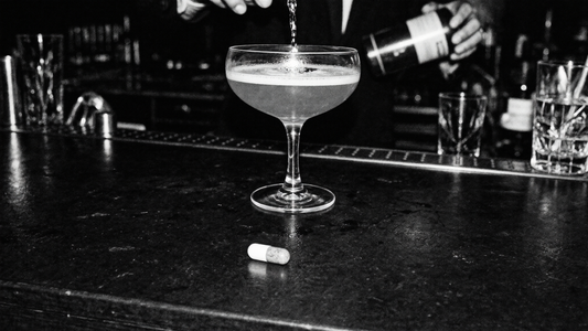 NAC and alcohol liver support - supplement capsule next to cocktail
